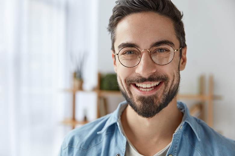 Man with healthy teeth and gums smiling
