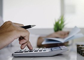 Man using calculator