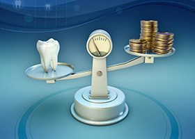 Tooth and coins on balance scale